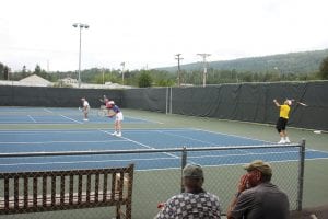 Below: Bill Hennessy and Frankie Jarchow, both of Cook County, were among the 35 tennis players who took part in the round-robin doubles tournament held Sunday, August 14.