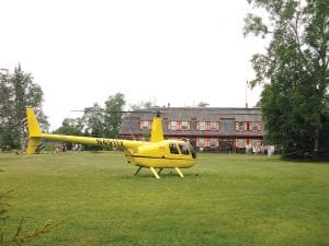 An unorthodox arrival at Naniboujou Lodge in Hovland drew a crowd in July. Len and Marge Busch of Orono, MN arrived for their reservations at the historic lodge by helicopter.