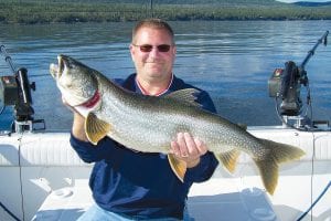 Richard Deal-Hansen caught this 12-pound, 32-inch lake trout on August 28 while fishing with Captain Darren Peck of Tofte Charters. The lake trout was released.