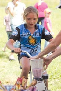 The first place female finisher in the six-mile was Reilly Wahlers of Grand Marais finishing with a net time of 1:06:18.8. And Reilly still looked fresh at the pedal-powered smoothie machine at the end of the race!