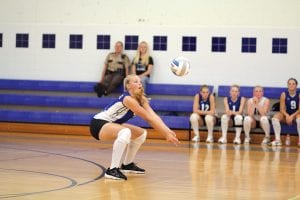 The Viking volleyball team started off the season 2-0. On the far left Ali Iverson gets ready to bump the ball while below, Bekah Laky (11) sets up Sarah Fagerman (6) for a spike against the Silver Bay Mariners. Above, Ashley Deschampe faked a wicked spike and then “dinked” the ball over the net as her opponents scrambled to cover the back half of the court. Many of the players worked out through the summer and their conditioning is showing against their opponents.