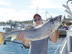 Chuck Wallerstedt practices for the upcoming Lutsen “Bill W. / Louise A.“ lake trout tournament running September 9 through September 18. Chuck caught this 18-pounder alone on his boat out of the Grand Marais Harbor on Saturday, August 27. For the always-long catch story or information regarding the trout tournament call Chuck at (218) 387-2920.