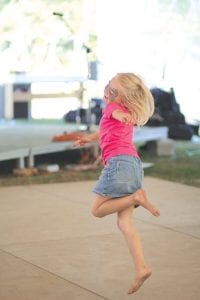 Emery Oberg expressed her joy through dance as she listened to the festival music. Little girls enjoyed the dance stage more than any other group.