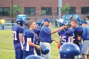 One of the reasons the Vikings traditionally have a strong defense is because of the coaching by Assistant Coach Mike Boomer. The no-nonsense coach has a passion for the game and the kids he coaches. It comes across in their efforts on the field and the respect they show the opposition. Above, Boomer gets the kids ready for their game against Esko.