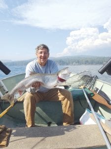 On Monday, September 12, Jeff Latz of Lutsen had the fun of hopping aboard the Free Loader Charter in Lutsen. With the impending storm, the lake trout fed willingly. This photo shows a fabulous fish and the smoke plumes from the Pagami Creek fire in Lake County in the background. No weight is available, as the Free Loader Charter is Dick Nelson’s “economy skiff.”