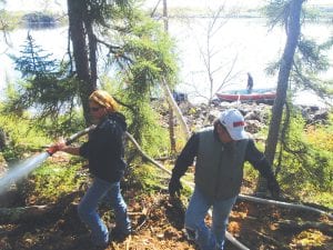 A fire on a small island on Saganaga Lake was extinguished by resort owners and anglers on Saturday, September 24. Laura and Larry Marxen of Chippewa Inn arrived by boat with a pump and hose and thoroughly soaked the ground.