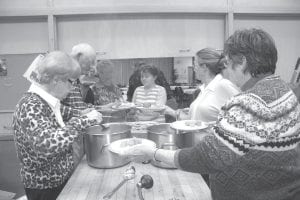 The Cook County Historical Society hosted its annual Fishcake Dinner on Friday, September 23 at St. John’s Catholic Church serving up fabulous fishcakes and a fun night of reminiscing. Above left: Historical Society Director Carrie McHugh oversaw the evening offering some entertaining lighthouse trivia—and helping to clean up of course! Above: Serving up the fishcakes and fixings were (L-R) Barb Erickson, Wayne Anderson, Philis Anderson and Karen Elvin. Waiting at the window is Mildred Thoreson, who said, “Make mine extra brown, please” and Harleigh Lindquist. Left: The fishcake dinner isn’t just about history and fish—there are also delectable desserts!