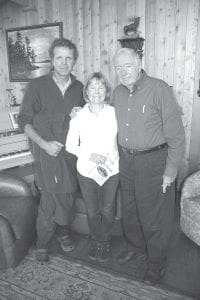 Left: Paul and Sue Schurke of Ely (L) with Hal Greenwood, host of a September 25 fundraiser on behalf of the Schroeder Area Historical Society. Paul and Sue talked about their adventures as Paul explored the North Pole and Sue developed an outdoor adventure clothing company. Above: Greenwood has been politically active for decades, and the lower level of his house is filled with photos and memorabilia of his experiences with some of the world’s leaders.