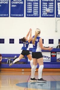 With Ali Iverson looking on, Ashley Deschampe (5) bumped the ball high for her frontcourt teammates to hammer home for a spike. The Vikings defeated the Barnum Bombers 3-0 in a very tough match.