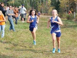 Emma Olfson (upper photo) and Abigale (Abby) Seipke and Sarah Shield (right) all have had great seasons running for the Vikings' girls cross country team. Here the young harriers are competing in the conference cross-country meet held on Pincushion on Wednesday, October 12.