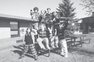 The Cook County varsity Knowledge Bowl team shows off their school spirit during Homecoming Week by donning pajamas and ugly sweaters—and by claiming first place in the Knowledge Bowl meet at Mountain Iron on Tuesday, Oct. 11. (L-R, front) Erica Weisberg, Madison Roy, Julia Larsen, Sara Carman. (L-R, back) Will Seaton, Morgan Weyrens, Sean MacDonell, Pete Summers.