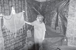 Jane (McDonald) Ranum shows off one of the friendly ghosts that will be on hand at the haunted house she and friends are making. The house will be open from October 29-31 from 6 p.m. to 8 p.m. Attendees are asked to bring non-perishable food items that will be donated to the Cook County Food Shelf.