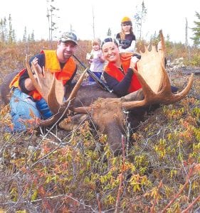 Above: The hunting has been good for the Perales family of Thunder Bay. Alan shot this moose, estimated at 1,300 pounds, within 10 minutes of the opening of the Canadian moose hunting season. It was a group event. Pictured here (L-R) are Alan, Ava, Kristi, and Alexis, but also with them were Kristi’s friend Ashley Hill and the family’s chocolate lab, Digger. 