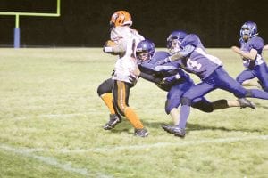 Mike Sjogren helps Gunner Anderson take down Ogilvie’s quarterback who was big, strong and fast and it often took more than one Viking player to bring him down. Out of all of the things the Viking players did well against unbeaten Ogilvie was fly to the ball and gang tackle. Ogilvie players were bigger but the Vikings were quicker and relentless in their pursuit on defense.