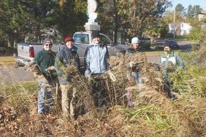 The folks who turned out on a blustery October day to thin and trim the rain garden next to the Grand Marais Public Library are (L-R) Maxine Linehan, Amber Humphrey, Kerrie Fabius, Ilena Berg and Theresa Oberg.