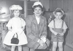 This well-dressed group was part of a Grand Marais Women’s Club fashion show at the East Bay Hotel in 1959 or 1960. The attractive trio is Leah Thomas, Jean Thomas, and Eric Thomas. Jean sewed the lovely outfits. It is believed that the photo was taken by local photographer M.J. Humphrey.