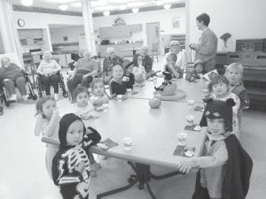 Halloween fun at the North Shore Care Center! The North Shore Preschool children performed at the North Shore Care Center on Halloween. They stopped to have a snack before they paraded through the halls to visit other departments to receive plenty of treats. Mrs. “H.” (Cheryl Hovde) has been bringing her preschool kids to the Care Center, hospital, and clinic on Halloween for 20 years.