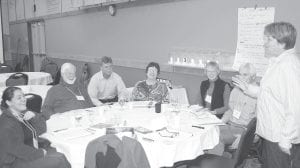 Cook County Commissioner Sue Hakes talks to her colleagues—the Grand Marais, Grand Portage and Gunflint Trail or “G-3” group—during the Heart of the Continent International Community Congress. About 80 people from communities in the “heart of the continent” met and learned from one another on October 24 – 27.