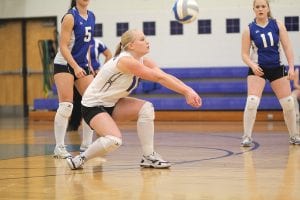 Cece Olsen goes low to bump the ball and set up her teammates in their match against Cherry. Despite playing a great match the Vikings fell to the Cherry Tigers in five games. It is the second year in a row that Cherry has halted the Vikings season in the play-offs.