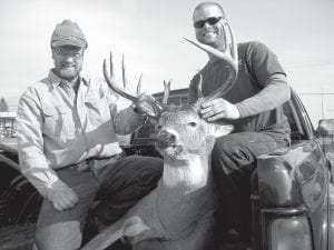 Jimmy Peterson (right) and his dad, Rusty Peterson, with the big buck that Jimmy got on opening day of rifle season. Jimmy’s buck was in second place in the Big Buck contest in both categories—it weighed in at 223.6 pounds and has an antler spread of 20.5 inches.