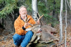 Above: David Johnson of Grand Marais had a successful first day of deer rifle season, shooting this 9-point buck at 8:15 on opening morning November 5.