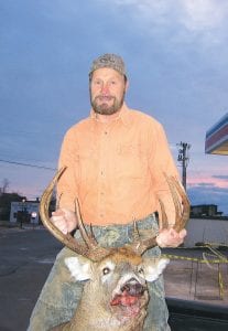 Right: Gary Schlienz of Grand Marais is now in the lead in the largest dressed weight category in the 2011 Buck’s Big Buck Contest with this huge 236-pound buck.