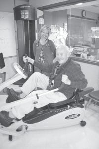 RN Dottie Roy and Warren Anderson in the North Shore Hospital cardiac rehab unit Roy is in charge of. The exercise equipment there is available for use by the public at a cost of $25 a month.