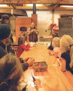 There were a number of family-friendly classes over the weekend. Author/illustrator Lauren Stringer shares the art of snowflake craft with some interested kids and parents.