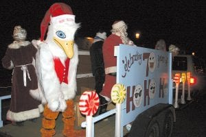 The Grand Marais Chamber of Commerce Christmas Parade was moved from the Tuesday before Thanksgiving to the Friday after, and that worked for a lot of people who donned festive attire and joined the fun—like Skipper the Joynes Ben Franklin mascot! Skipper, Santa and friends threw cute stuffed toy “snowballs” to the crowd. The Joynes crew took home the prize for the best business float.