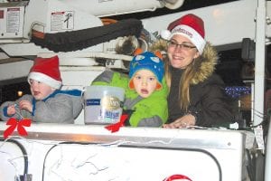 Grand Marais Public Utilities got in the holiday mood with family members of city workers—Toby Stockman and Brody and Casey Bronikowski—tossing treats.