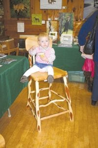 The Christmas sale includes wonderful handcrafts, like this diamond willow chair created by Bruce Updyke— a perfect resting spot for a tired baby.