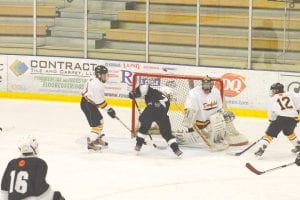 The North Shore Bantams—the combined team of Grand Marais, Silver Bay and Two Harbors skaters­— took on Duluth Denfel and came away with a victory, 5-3. With Nick Osbakken (16) looking on, Ryan Rasmussen does his best Sidney Crosby impersonation and shoots the puck past the Denfeld goalie.