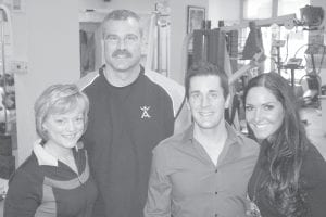 Mark and Mary Black (on left) recently purchased the Pump House Fitness Center in Grand Marais. They hosted an open house on Saturday, December 3 to give the community the chance to view the facility—and to meet motivational fitness speakers Chris and Lori Harder.