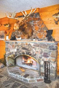 Cross River Lodge’s fireplace is original to the lodge that Charlie Johnson built in the 1920s and continues to help guests warm up after outdoor adventures near the end of the Gunflint Trail. The lodge features cozy seating by the fireplace, a wall of windows overlooking the lake, a lounging area with large-screen satellite TV, a dining room where homemade food is served, and a screened porch with a gas fireplace.