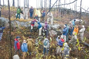 A large group of geologists and geology enthusiasts from around the world converged in October on a site that reveals evidence of a catastrophic meteor impact before the days of the dinosaurs. The site was discovered near the end of the Gunflint Trail after the 2007 Ham Lake fire burned the forest down to the rock underneath. (Left) This is a dramatic example of the molten fallout that spread over existing rock like frosting after the mountain-sized meteor hit the Earth several hundred miles away.