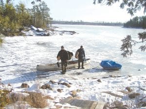 Marco Manzo II and Marco Manzo III tentatively set out from Sagonto Resort, on the Canadian side of Lake Saganaga on Sunday, December 11. They traveled slowly to the American side to get their mail—an eight-mile round-trip journey.