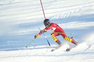 Above: Charlie Lawler cuts hard around a gate as he races to a 13th place finish in the Lutsen invitational. Left: With team captain Katie Smedstad’s second place at Lutsen the girl’s team finished in second in the competition.