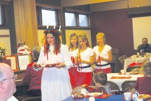 St. Lucia Day is December 13—the darkest day of the year—but St. Lucia arrived early at Julefest at Bethlehem Lutheran Church on Saturday, December 10. This year’s St. Lucia is MaeAnna LaFavor of Hovland. St. Lucia had three attendants this year—Sarah Toftey, Hannah Toftey and Tarin Hanson. Their arrival at Julefest brings the gift of light in the dark of winter. See more about Julefest on page A4.