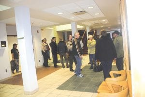 Cook County sheriff deputies talk to witnesses and begin to close down the building in the aftermath of a shooting on the second floor of the Cook County courthouse on Thursday, December 15. Daniel Schlienz, 42, of Grand Marais was taken into custody and has been charged with two counts of premeditated attempted first-degree murder. Schlienz’s mother, Ginger Berglund, frozen at the center of the chaos, fights back tears.