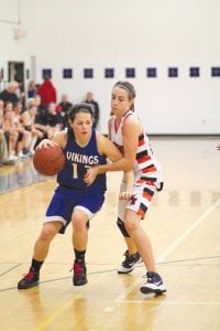 Jessica Berg-Collman (3) and Breana Peterson (1) are both getting lots of time playing for the varsity this year. The two are both athletic and quick and are maturing as basketball players before the legions of Viking fans.