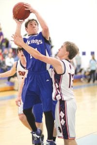 Senior guard Mike Sjogren, going up for a two-point shot, has provided a great spark for the boy’s basketball team this year. Although he doesn’t score much, Sjogren plays tough defense, handles the ball well, and plays with a lot of energy.