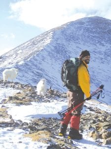 Sometimes training at high altitude isn’t all bad. Here Lonnie Dupre meets a couple of mountain goats on Quandary Peak in Colorado where he went for some physical conditioning before his second attempt at climbing Mount Denali. At 20,350 feet, Mount Denali is the tallest peak in North America.