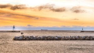 Although ore boats frequently pass by North Shore communities, folks on shore never tire of the sight. Don Davison of Grand Marais took this photo of a “laker” hugging the shore on December 27.