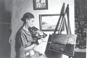 Ellen Smith Douglas, 1862 – 1946, was a self-taught artist who managed to find a way to study art, despite overbearing school masters and a life with few luxuries. “Ma” Douglas as she was known by many and her husband operated a boarding house in Grand Marais for many years. After her husband Ed Douglas died in 1923, she carried on with managing the boarding house on her own for 15 years. All that time, she had no time for painting, but according to an article by Ade Toftey in the Cook County News-Herald on her death in 1946, the glorious North Shore sunsets did not escape her. Ma Douglas was finally able to paint when she retired and the walls of the two-room cabin where she lived were eventually filled with her creations. Tom Toftey, who shared this photo and information with the News-Herald, asked anyone who owns a “Ma” Douglas painting to contact him through the News-Herald.