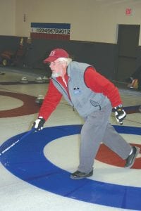 Like a lot of the older curlers, Jim King uses a push-pole to throw his rock down the ice. Although it takes a little getting used to, King and others who use this method have great success curling, and their knees don’t get beaten up in the process.