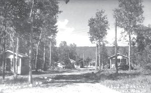 Tomteboda Log Cabins, now part of the Grand Marais Inn on the western end of Grand Marais, are pictured here in a postcard circa 1948. This picture of the cabins originally built in 1925 by Swedish settlers is part of the Minnesota Historical Society’s photograph collection. Today’s advertising echoes that of 1948, “A leisurely stroll from the Tomteboda takes you to nearby restaurants, shopping and the Lake Superior shoreline.”