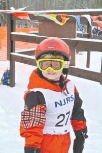 The Lutsen Junior Alpine Club traveled to Mont-Du-Lac Recreation area on New Year’s Day 2012 for race No. 1 of the Northland Junior Race Series. The Lutsen skiers competed in a field of 120 area ski racers. Upper left: Newcomer Weston Heeren at his very first race! Upper right: Santina McMillan and Hanna Borson enjoying a great practice on Ullr. Above right: Team veteran Caleb Phillips speeds down the hill. Above left: Will Surbaugh shows off his Alpine skills on the course.