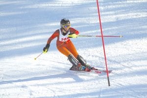 Signe Larson displays great slalom technique as she slashes her way down the course (legs together, good body lean) at the Mount Du Lac meet where she finished third overall and led the Vikings to a tie for first place.