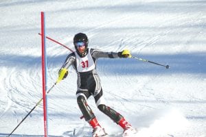 Skiing in front of friends and family, Kyle Martinson (above) was pleased with his 13th place finish at the Moose Mountain Invitational. Seventh grader Jack Viren (left) recently placed first in a JV race and continues to improve with each race.