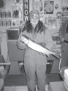 Left: Clearwater Lake has been giving up some nice lake trout. AliceKae Stevens of Brainerd, MN shows off her catch. The fish weighed in at 4 pounds 6 ounces.